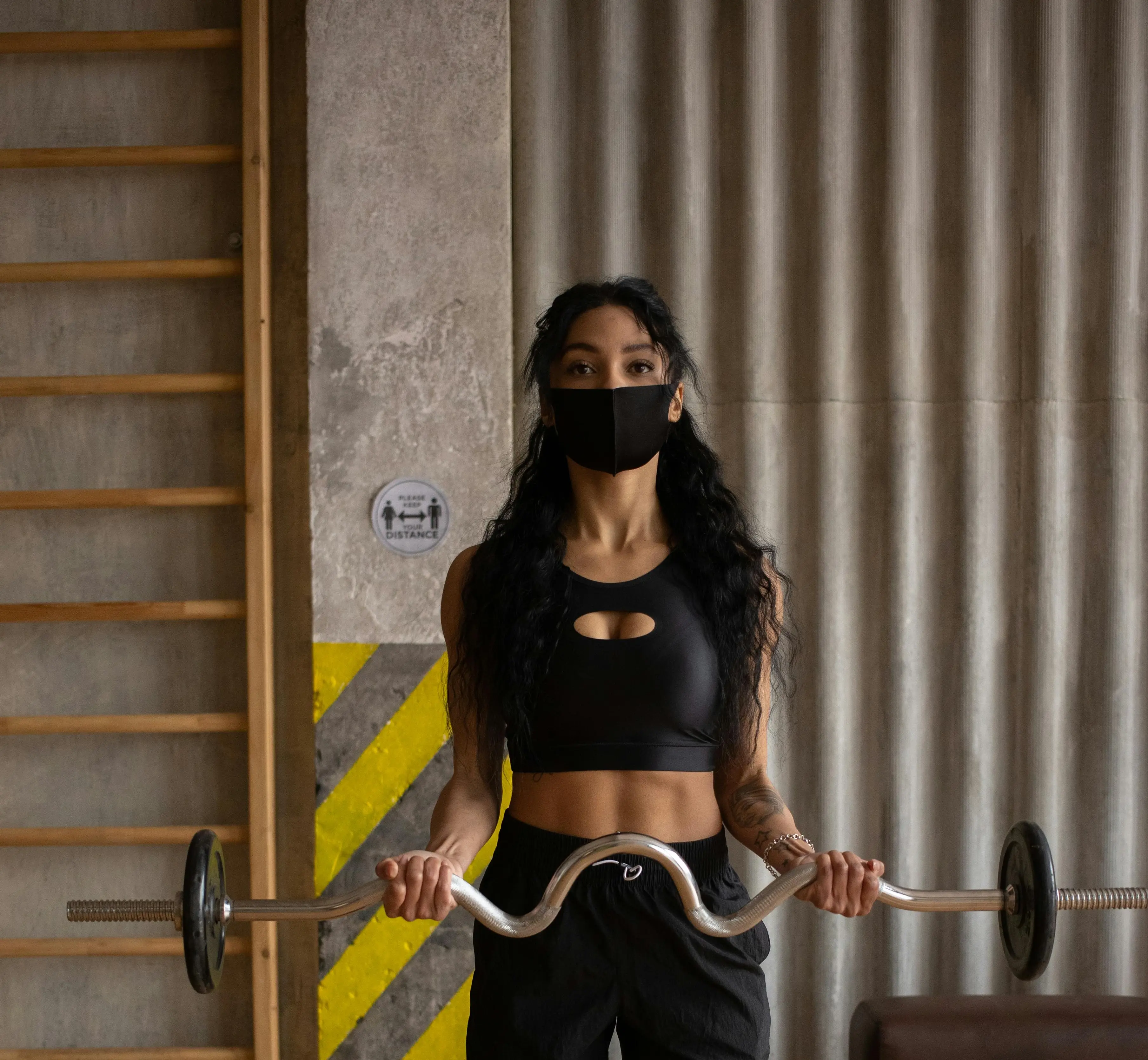 Person exercising on treadmill wearing face mask with heart rate and oxygen saturation monitors, representing exercise physiology research